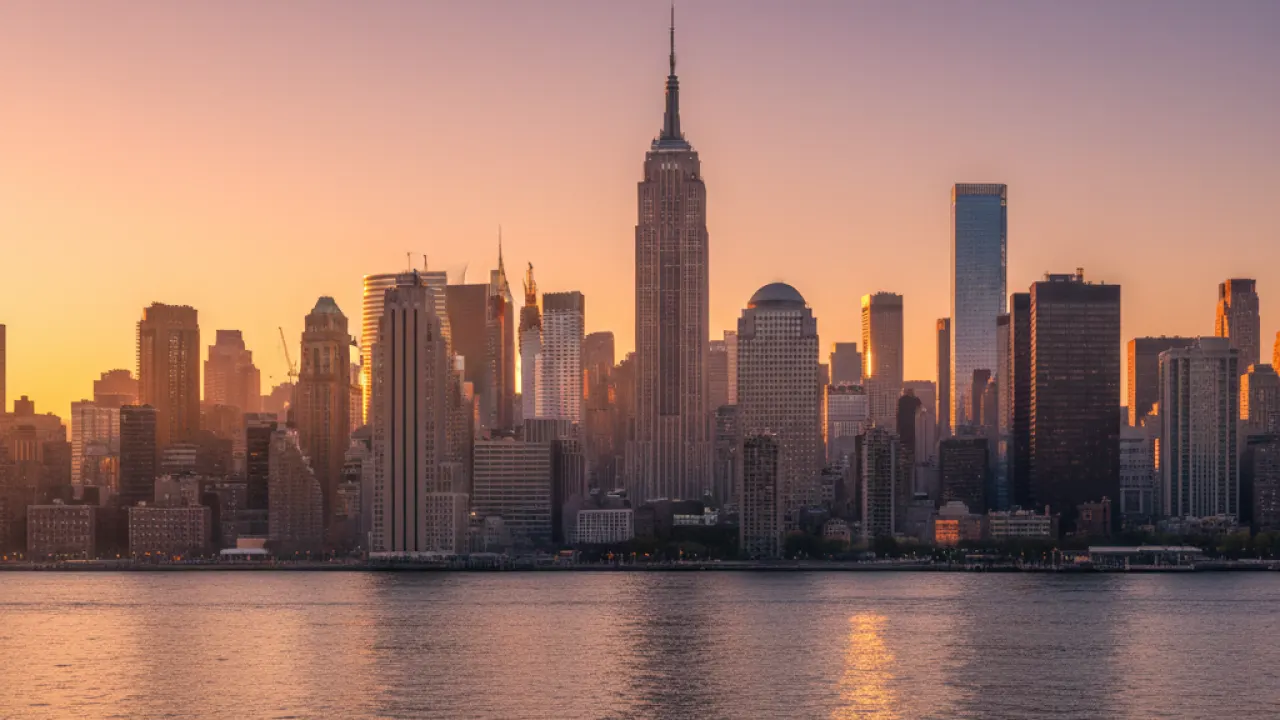 New York City Skyline at Golden Hour - Best US Cities to Visit Manhattan skyline at golden hour with the Empire State Building reflecting sunset light, one of the best cities to visit in the US