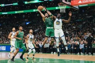 best basketball players of all time - NBA game action under bright arena lights
